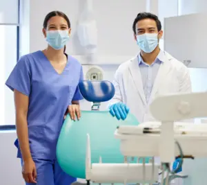 portrait of a young dentist and his assistant work 2023 11 27 05 06 07 utc